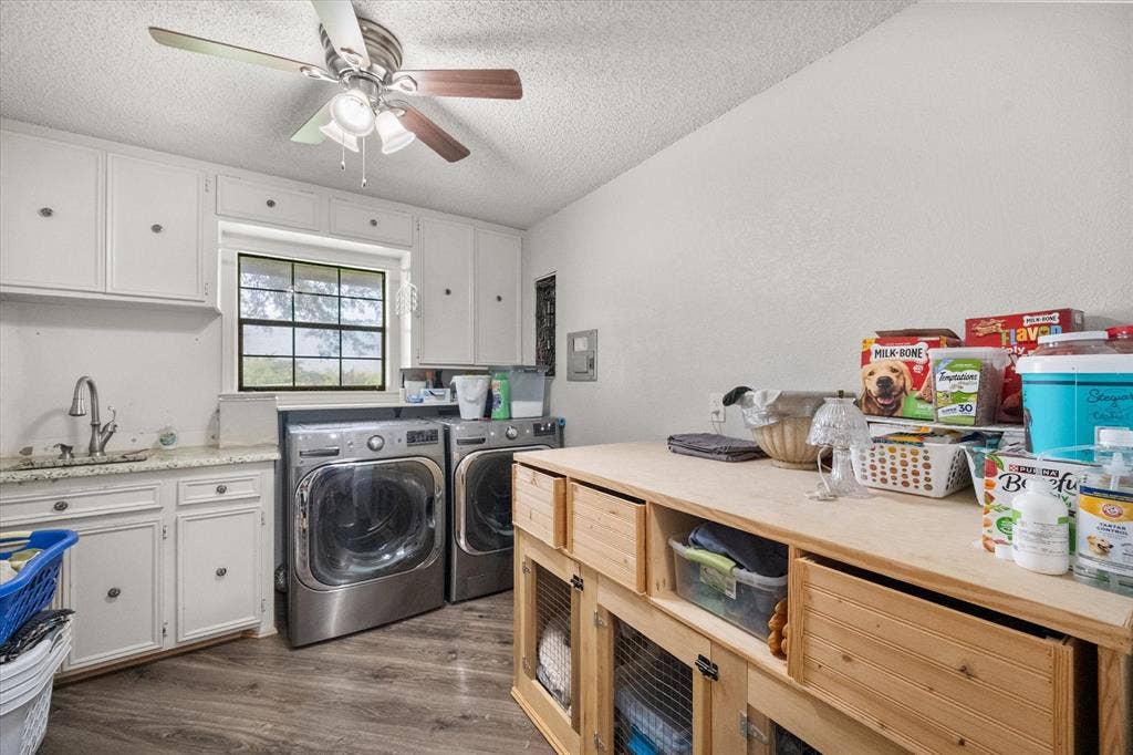 This the laundry room every family should have. It's the size of a bedroom! Approx 9' x 11'!! With sink, granite, and built in cabinets!