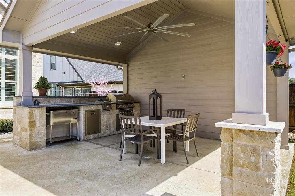 404 Travelers Terrace, Argyle, TX 76226 The cabana is equipped with a built-in grill with side burner, leather granite countertop & an electrical outlet for your TV.