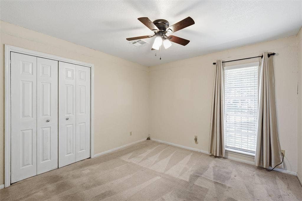 Neutral-toned interior with carpet flooring