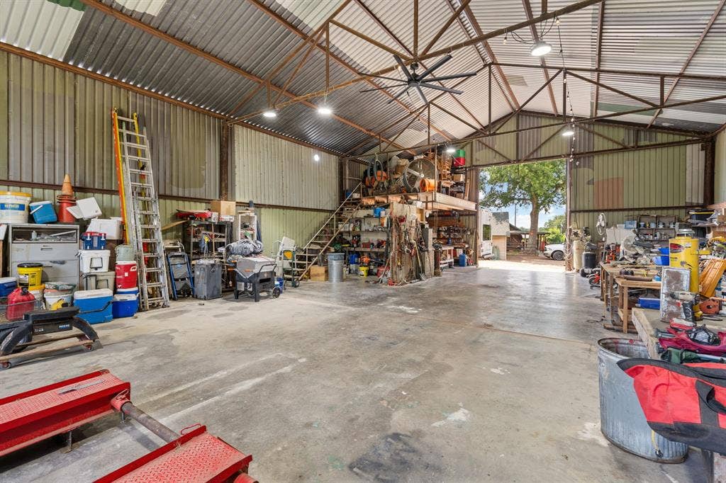13494 County Road 2919, Eustace, TX 75124 Spacious multi-purpose building with a high-pitched metal roof and industrial lighting