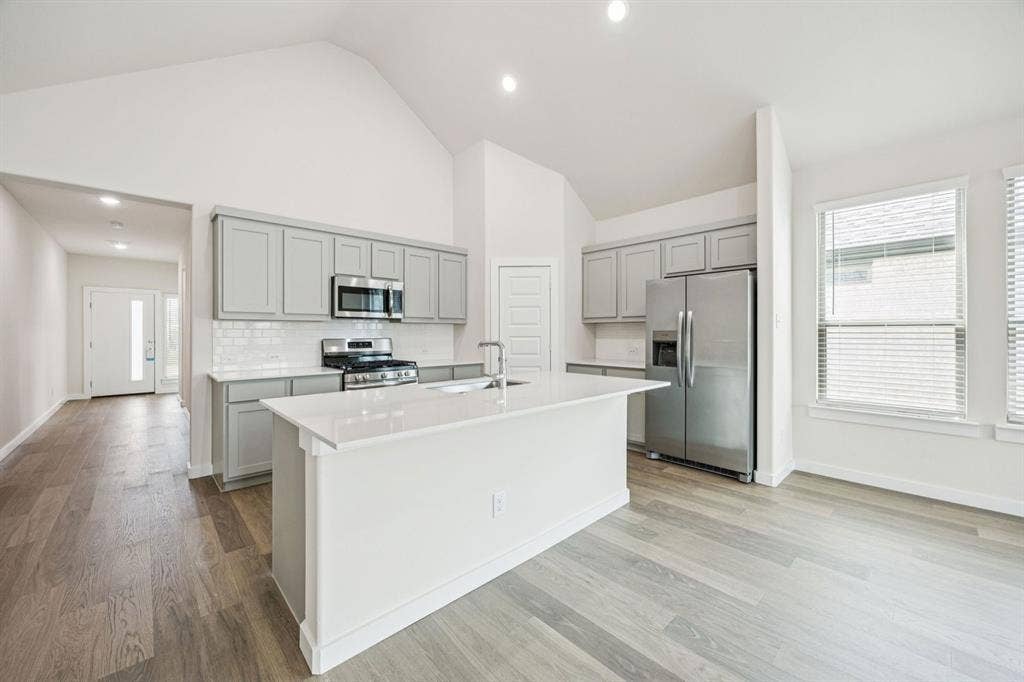 909 Bright Acre Trail, Lavon, TX 75166 Kitchen in the Claret home plan by Trophy Signature Homes – REPRESENTATIVE PHOTO