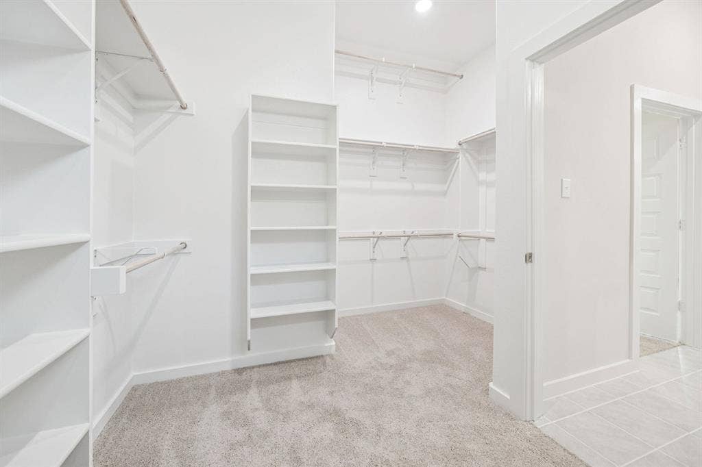 909 Bright Acre Trail, Lavon, TX 75166 Primary Closet in the Claret home plan by Trophy Signature Homes – REPRESENTATIVE PHOTO