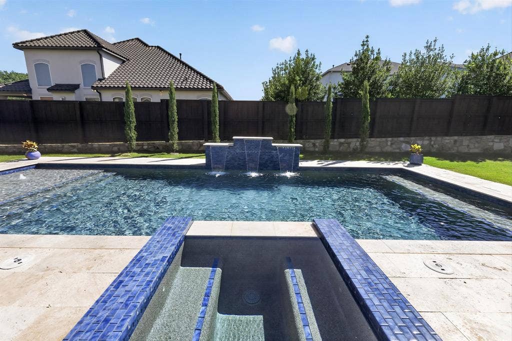 12226 Lazio Lane, Frisco, TX 75035 Resort-style pool with integrated spa and waterfall feature