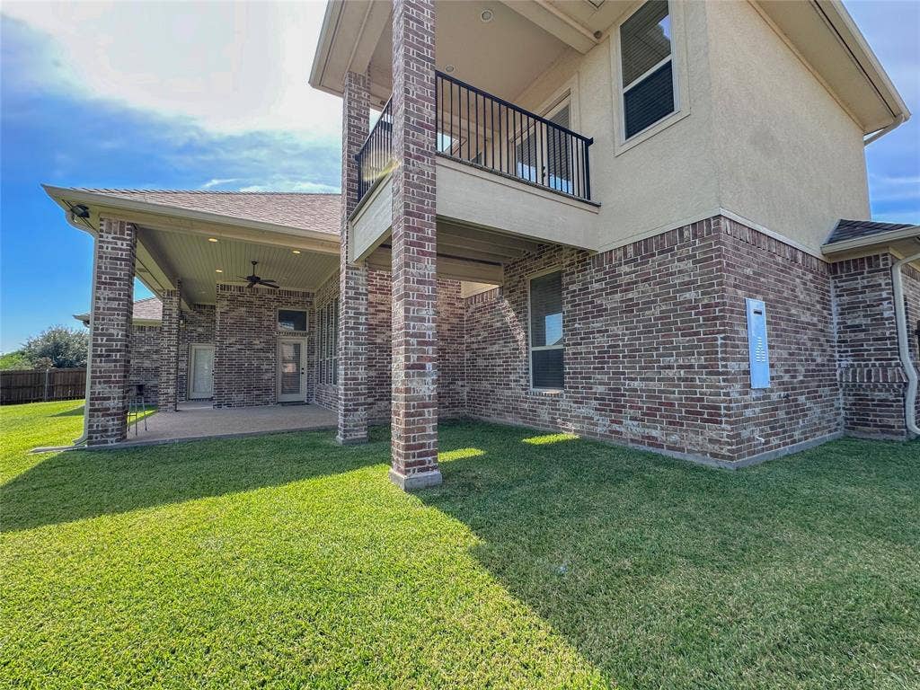 1100 Wessex Drive, Woodway, TX 76712 Expansive rear exterior featuring a covered patio with recessed lighting and a ceiling fan