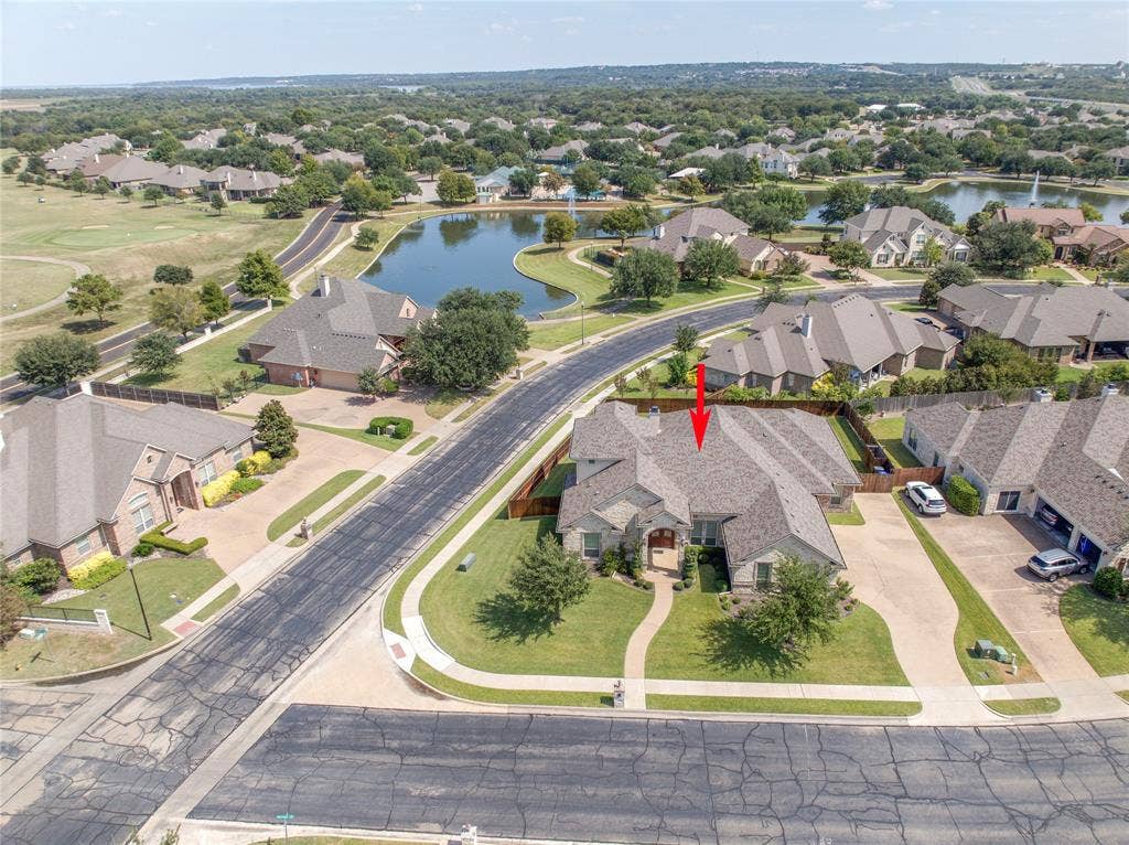 1100 Wessex Drive, Woodway, TX 76712 Aerial overview of a residential property featuring a stone and brick exterior