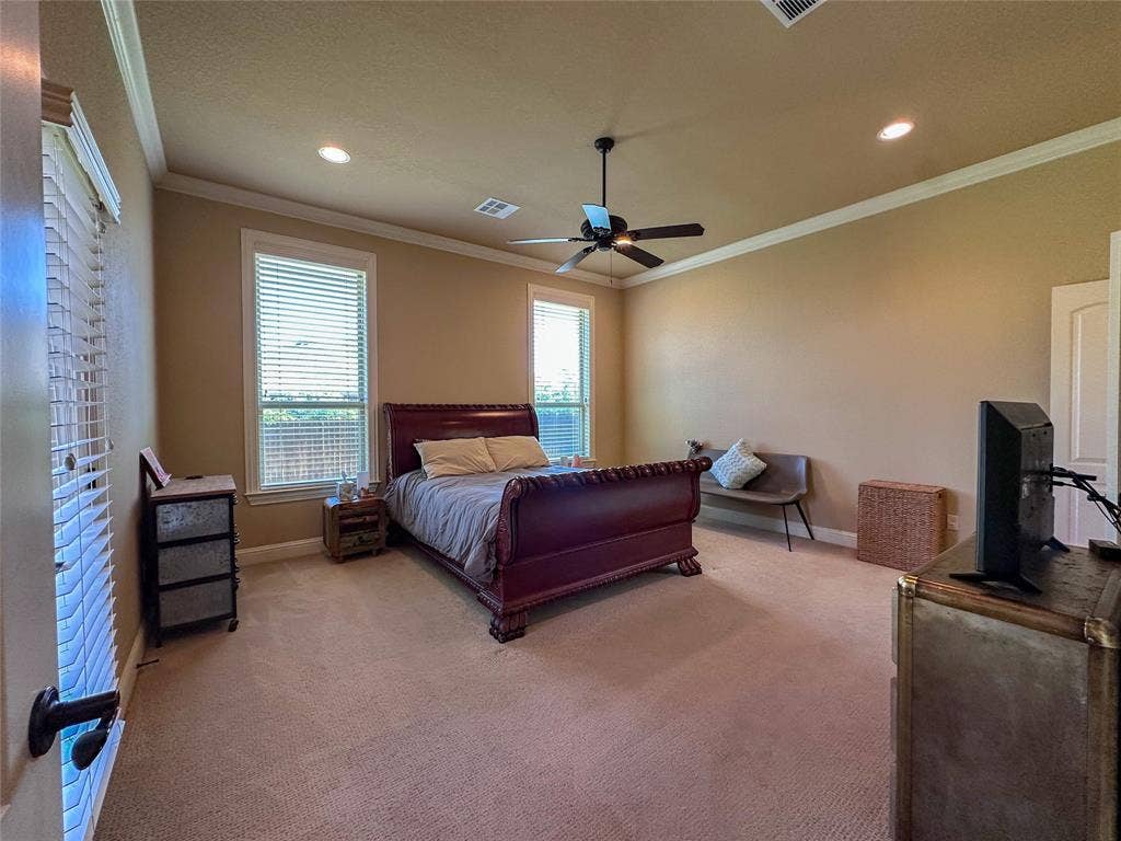 1100 Wessex Drive, Woodway, TX 76712 Carpeted room featuring two windows with horizontal blinds, recessed lighting, and a ceiling fan with a light fixture