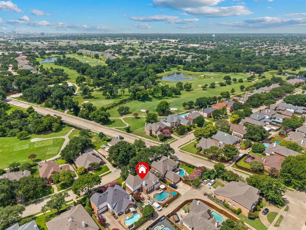 669 Water Oak Drive, Plano, TX 75025 Aerial perspective showcasing a residential neighborhood with individual properties featuring private swimming pools