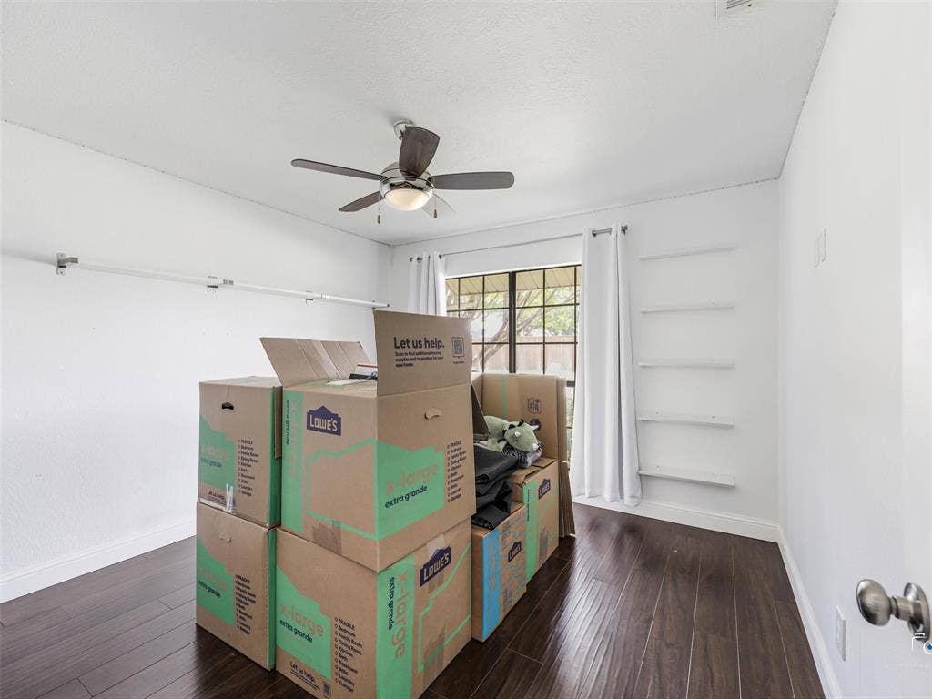 6701 Vero Drive, Plano, TX 75023 Bedroom 4 has the same wood floors and made a perfect home office for the current homeowner. It is currently all packed up and ready to move!