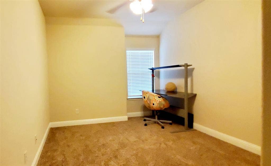 104 Rustic Oak Lane, McKinney, TX 75072 Carpeted room featuring a ceiling fan, window with blinds, and light-toned walls