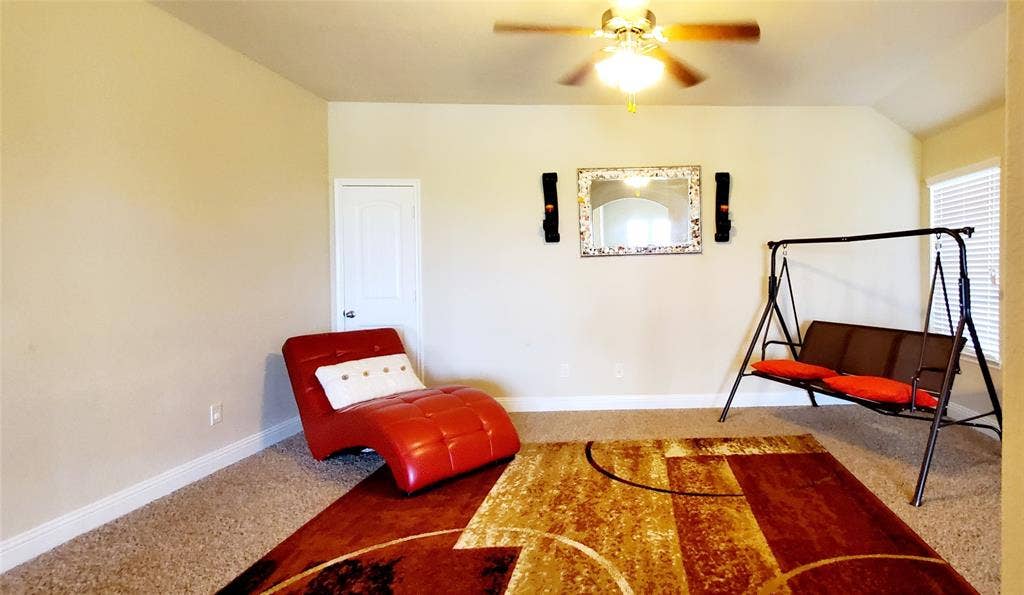 104 Rustic Oak Lane, McKinney, TX 75072 Spacious room with neutral wall tones and a textured carpet