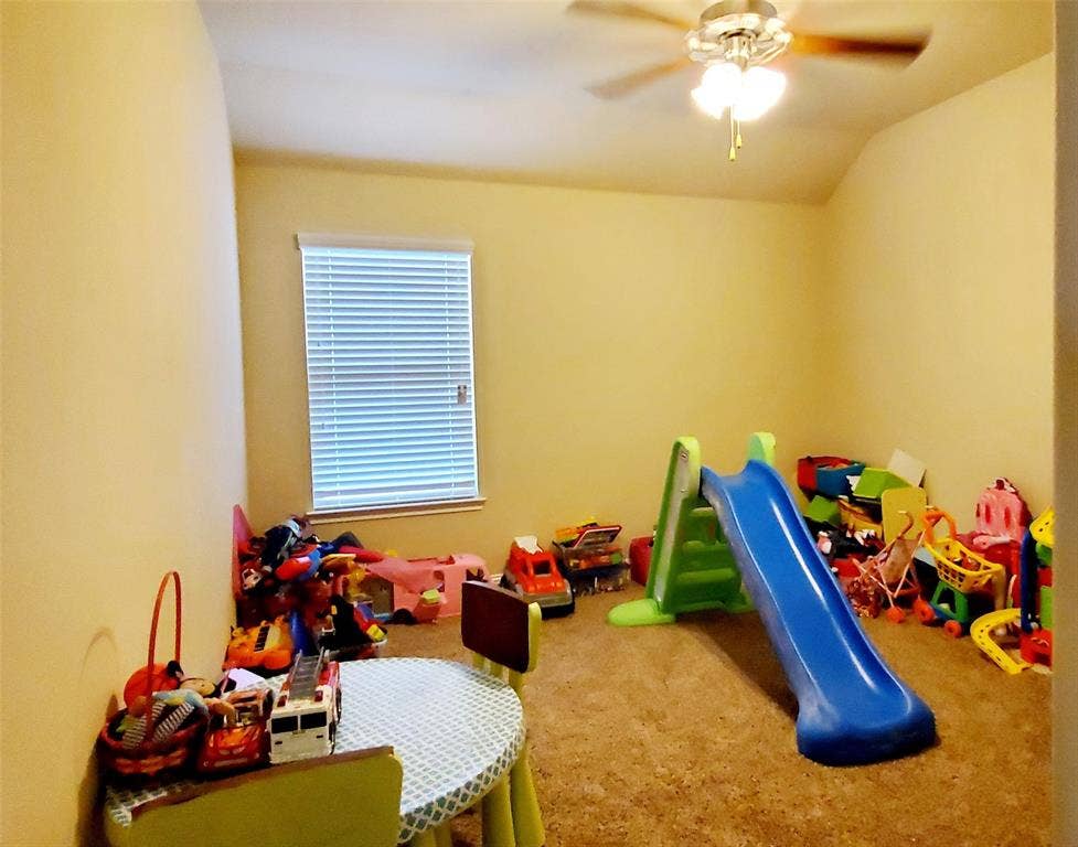 104 Rustic Oak Lane, McKinney, TX 75072 Carpeted room with a ceiling fan light fixture