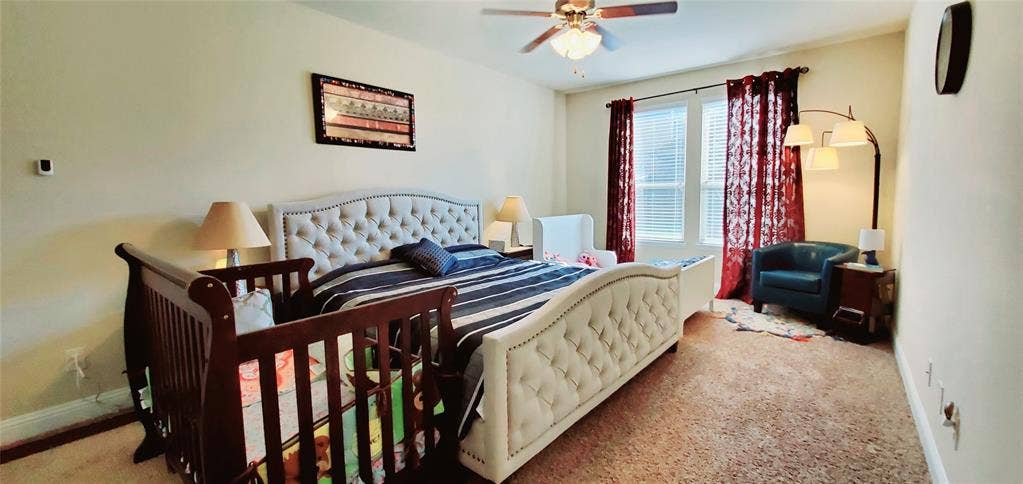 104 Rustic Oak Lane, McKinney, TX 75072 Spacious room featuring carpeting, a ceiling fan with light fixture, and windows with blinds