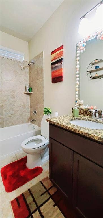 104 Rustic Oak Lane, McKinney, TX 75072 Bathroom featuring a tub/shower combination with tile surround, a dark wood-finish vanity with a granite-style countertop, and a single basin sink