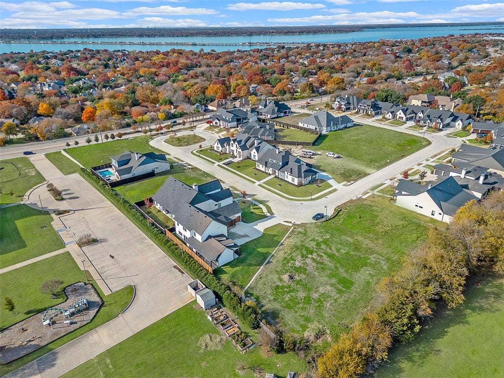 1203 Chapel Drive, Rockwall, TX 75032 Spacious residential community with varied architectural styles, green spaces, and paved roads