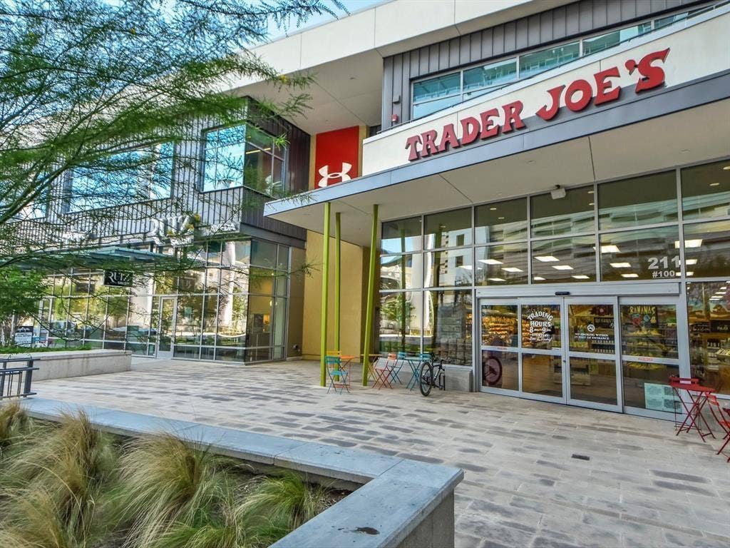 360 Nueces Street, #2110, Austin, TX 78701 Contemporary commercial storefront featuring expansive glass windows and a prominent Trader Joe's sign