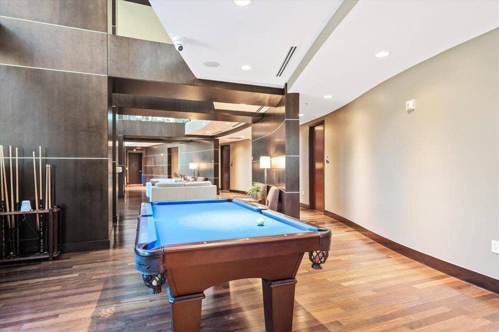 360 Nueces Street, #2110, Austin, TX 78701 Billiards area featuring wood-finish flooring, recessed lighting, and a neutral wall palette
