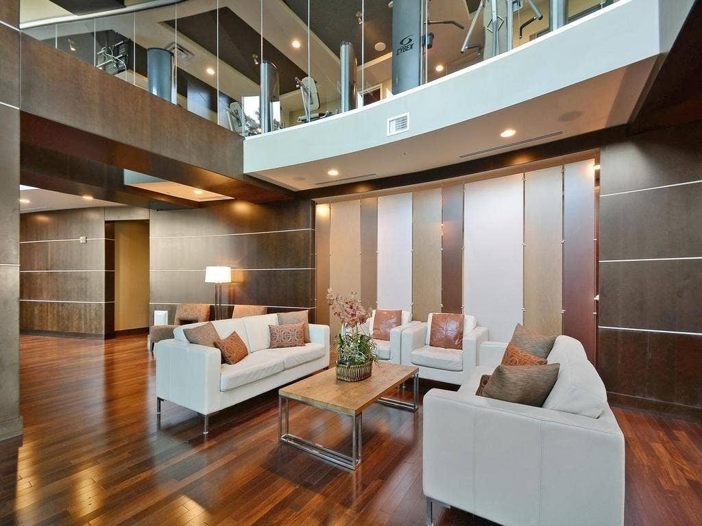 360 Nueces Street, #2110, Austin, TX 78701 Two-story communal space featuring wood-finish flooring and recessed lighting