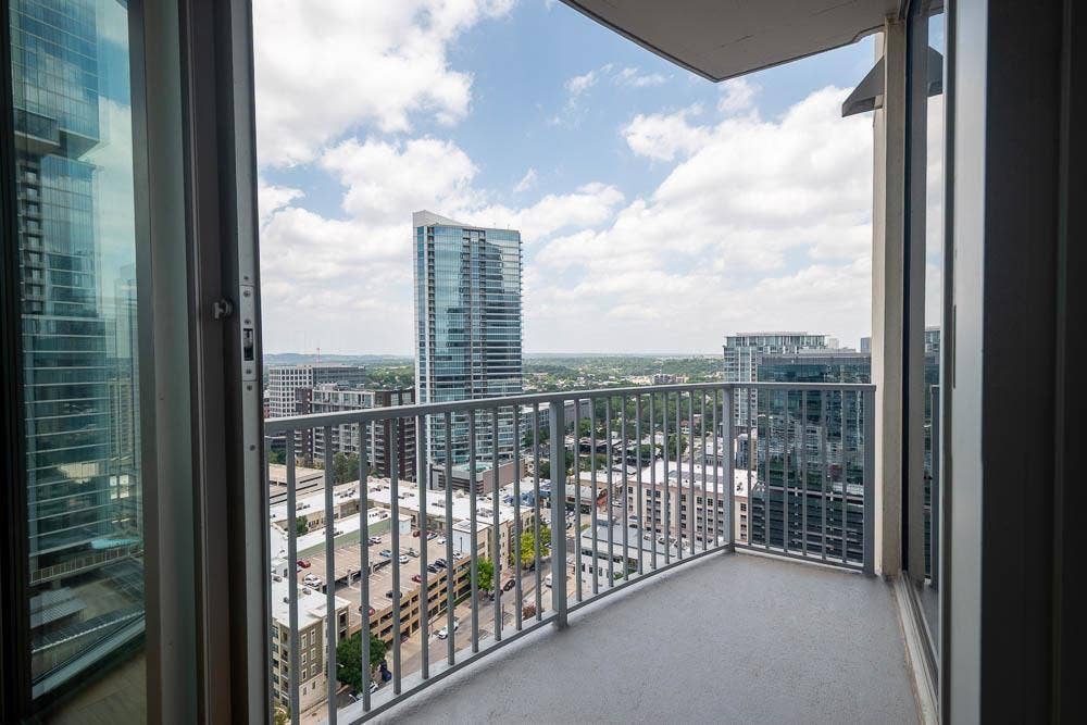 360 Nueces Street, #2110, Austin, TX 78701 Private balcony featuring an open-air design and metal railing