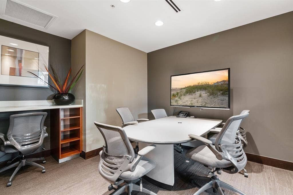360 Nueces Street, #2110, Austin, TX 78701 Meeting room featuring a large wall-mounted display, recessed ceiling lighting, and a built-in countertop with shelving