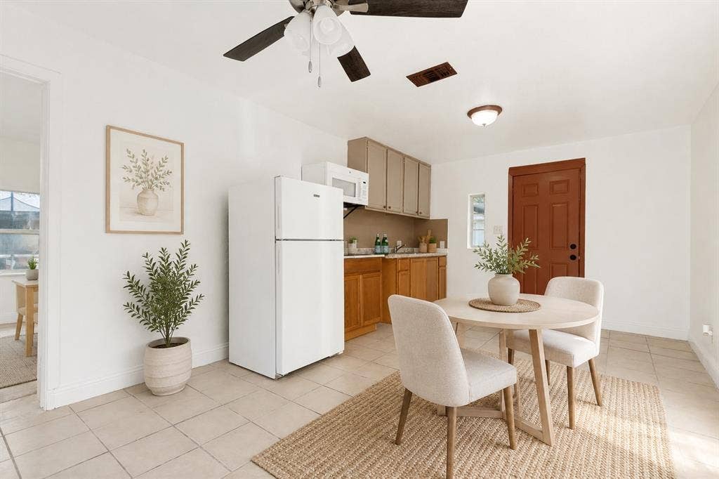 403 N Britain Road, #407B, Irving, TX 75061 Kitchenette featuring ceramic tile flooring, a ceiling fan, wood-finish lower cabinetry, and light-toned upper cabinetry