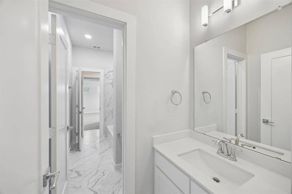 4617 Starlight Drive, McKinney, TX 75071 Dual Entry Bathroom in the Picasso II home plan by Trophy Signature Homes – REPRESENTATIVE PHOTO