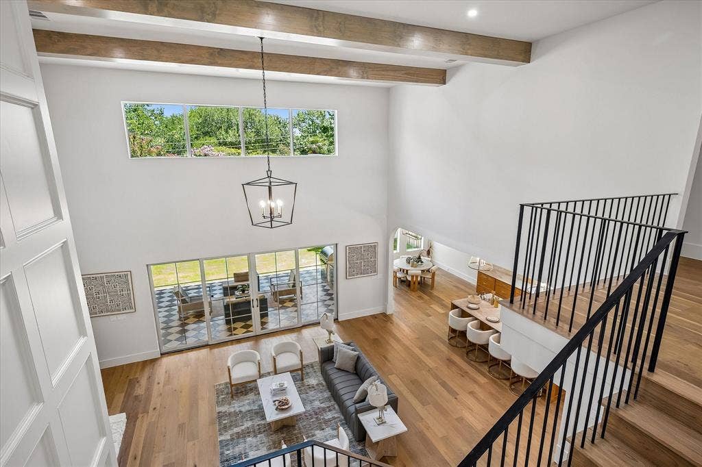 3304 Townsend Drive, Dallas, TX 75229 Living room overhead, stone fireplace, exposed beams, patio access
