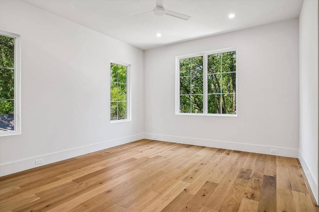 3304 Townsend Drive, Dallas, TX 75229 Secondary bedroom, hardwood floors, multi-window views, ceiling fan