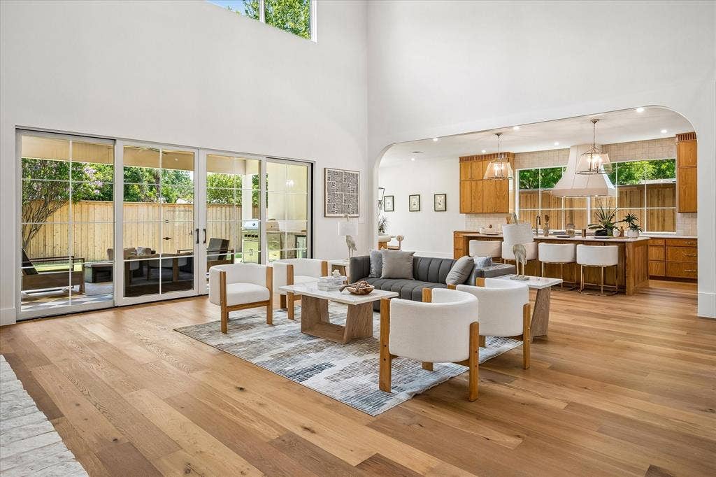 3304 Townsend Drive, Dallas, TX 75229 Living to patio view, two-story ceiling, open kitchen sight line