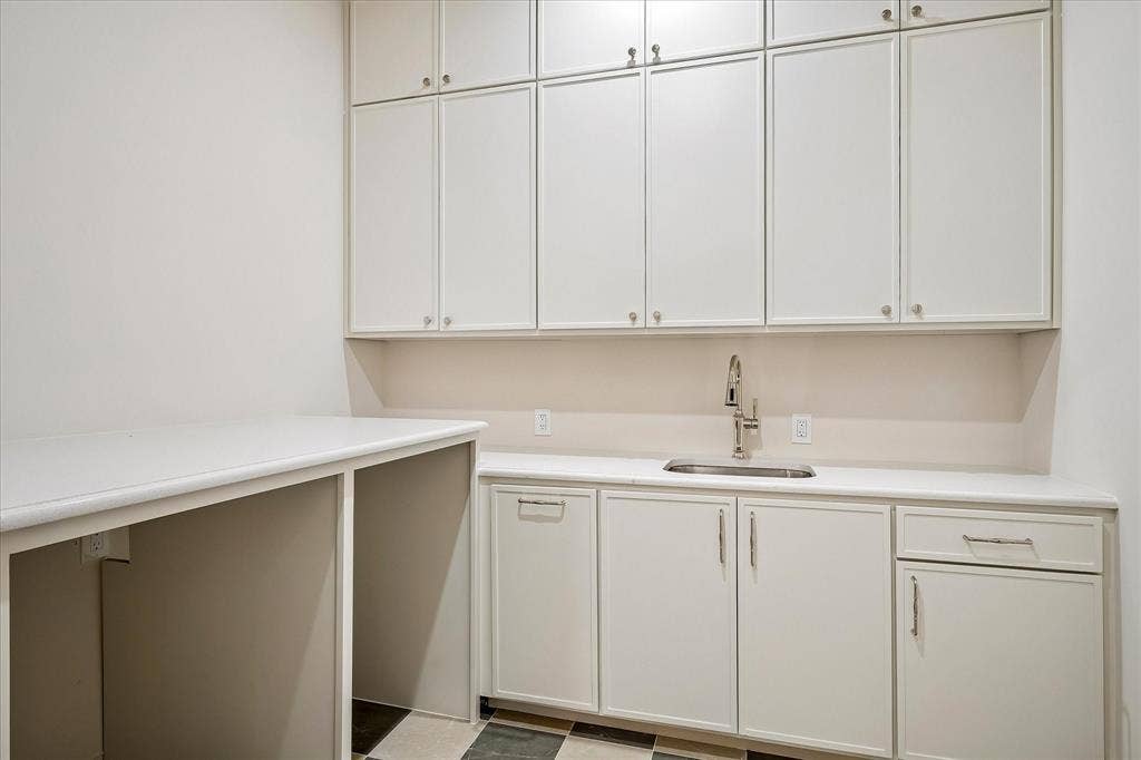 3304 Townsend Drive, Dallas, TX 75229 First-floor laundry, built-in cabinetry, utility sink, stone countertop