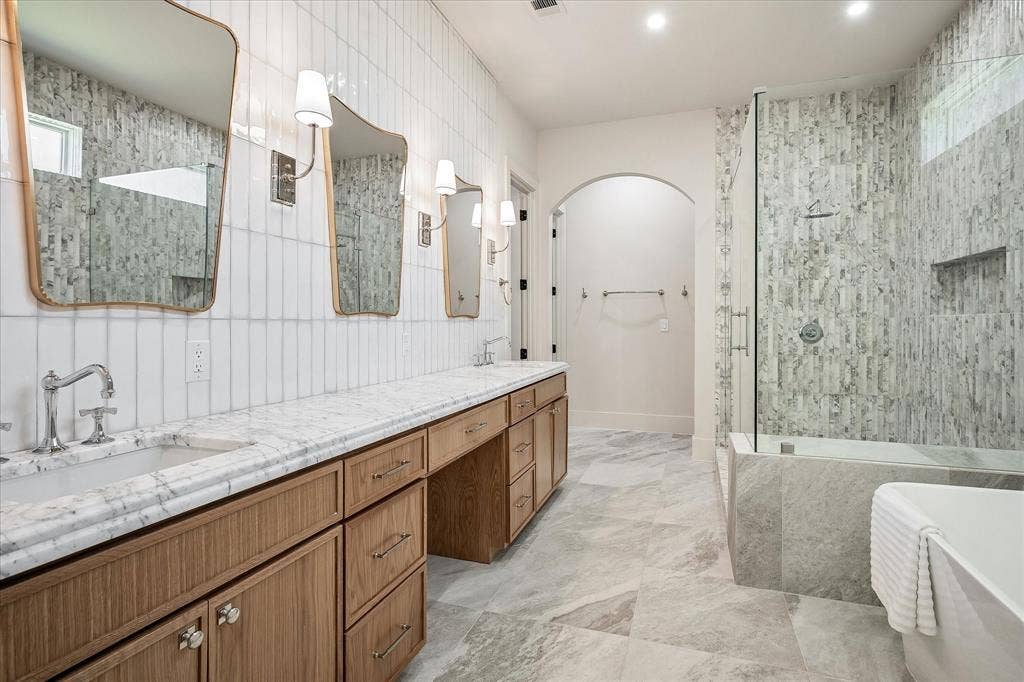 3304 Townsend Drive, Dallas, TX 75229 Primary bath, dual vanity, White Arabescato honed stone countertop, arched closet entry