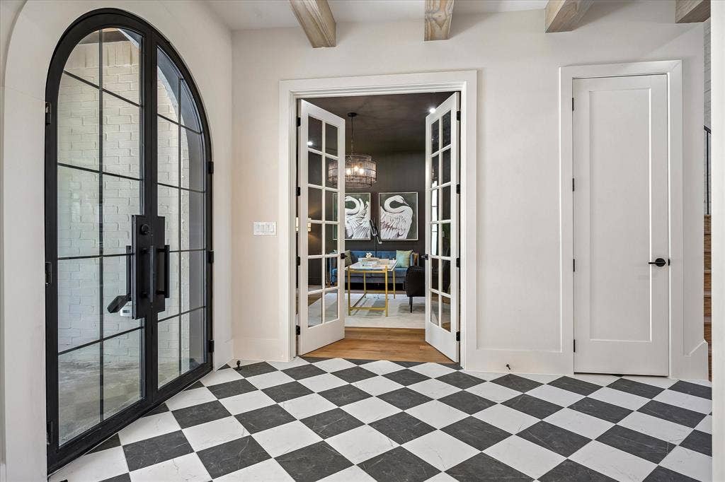 3304 Townsend Drive, Dallas, TX 75229 Arched iron and glass entry, checkered tile floor, French doors to study, exposed beam ceiling