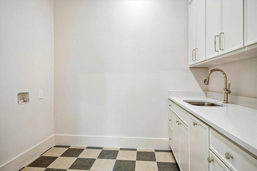 3304 Townsend Drive, Dallas, TX 75229 Second-floor laundry, built-in cabinetry, utility sink, stone countertop