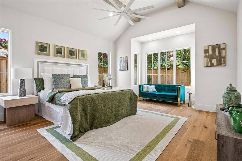 3304 Townsend Drive, Dallas, TX 75229 First-floor primary suite, vaulted ceiling with beams, ceiling fan, sitting area, hardwood floors