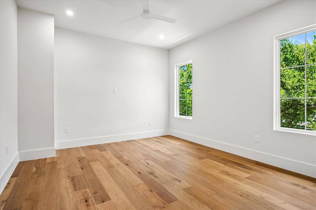 3304 Townsend Drive, Dallas, TX 75229 Secondary bedroom, hardwood floors, multi-window views