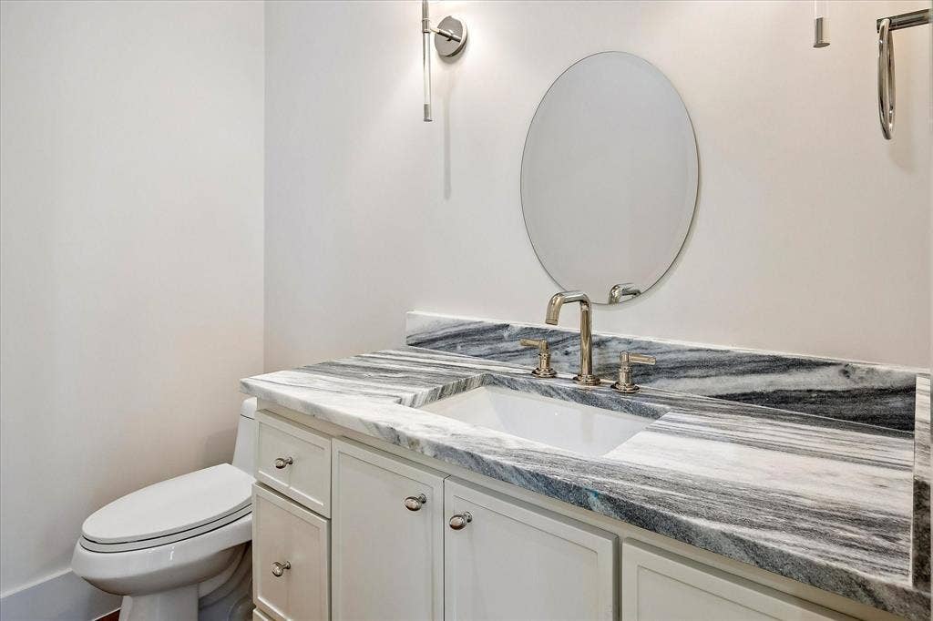 3304 Townsend Drive, Dallas, TX 75229 Powder, Shadow Storm stone countertop, round mirror, sconce lighting