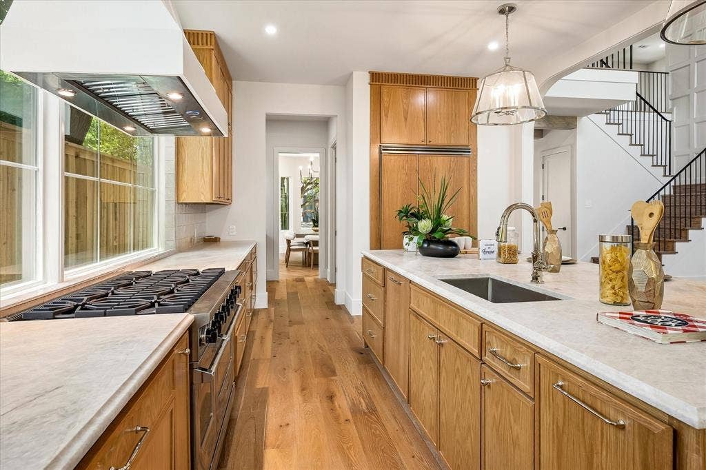3304 Townsend Drive, Dallas, TX 75229 Professional range, island sink, Taj Mahal quartzite countertops