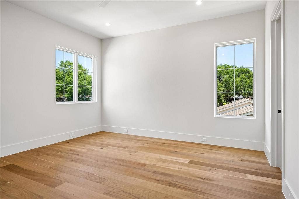 3304 Townsend Drive, Dallas, TX 75229 Secondary bedroom, hardwood floors, multi-window views, ceiling fan