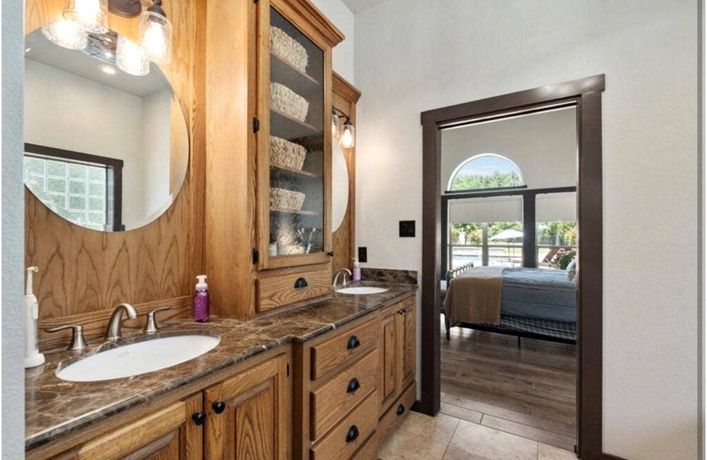 106 Timber Hill, Athens, TX 75751 Dual vanity with wood-finish cabinetry, countertop, and integrated sinks