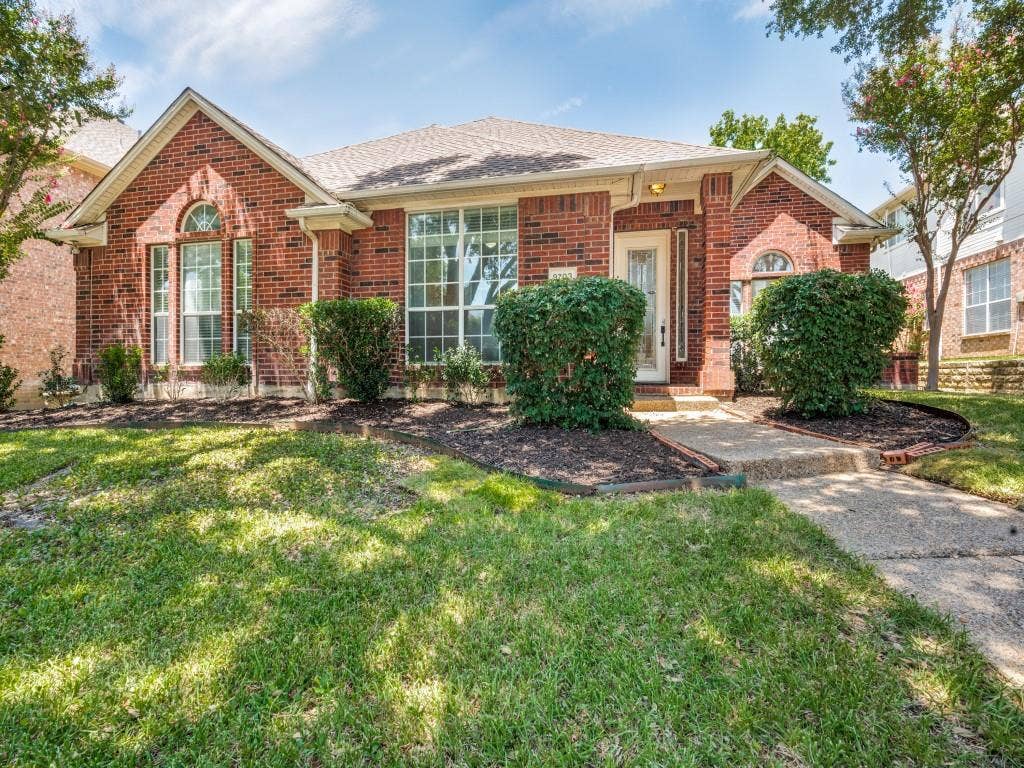 9703 Raven Lane, Irving, TX 75063 Brick facade residence with a gabled roofline