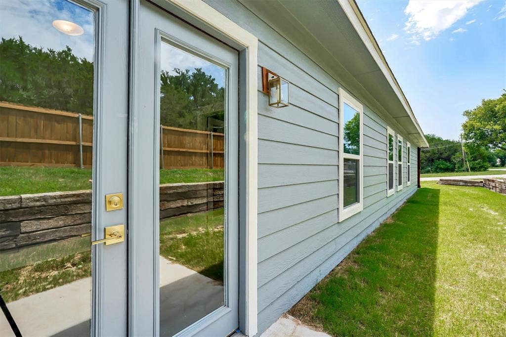 Light gray siding exterior with multiple windows