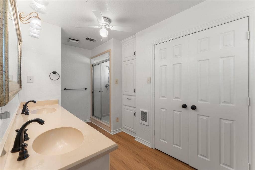 116 Meadowood Road, Enchanted Oaks, TX 75156 Dual sink vanity with matte black fixtures and light-toned countertop