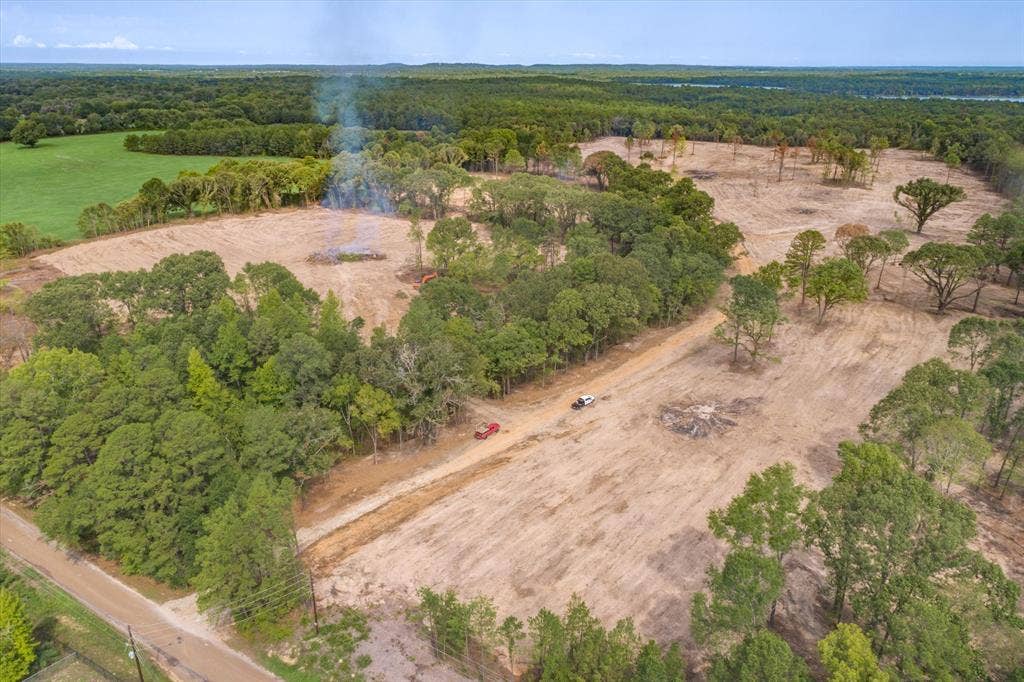 Tract 2 - TBD County Road 4307 Road, Larue, TX 75770 Expansive cleared land featuring scattered mature trees, a dirt road, and surrounding dense woodland