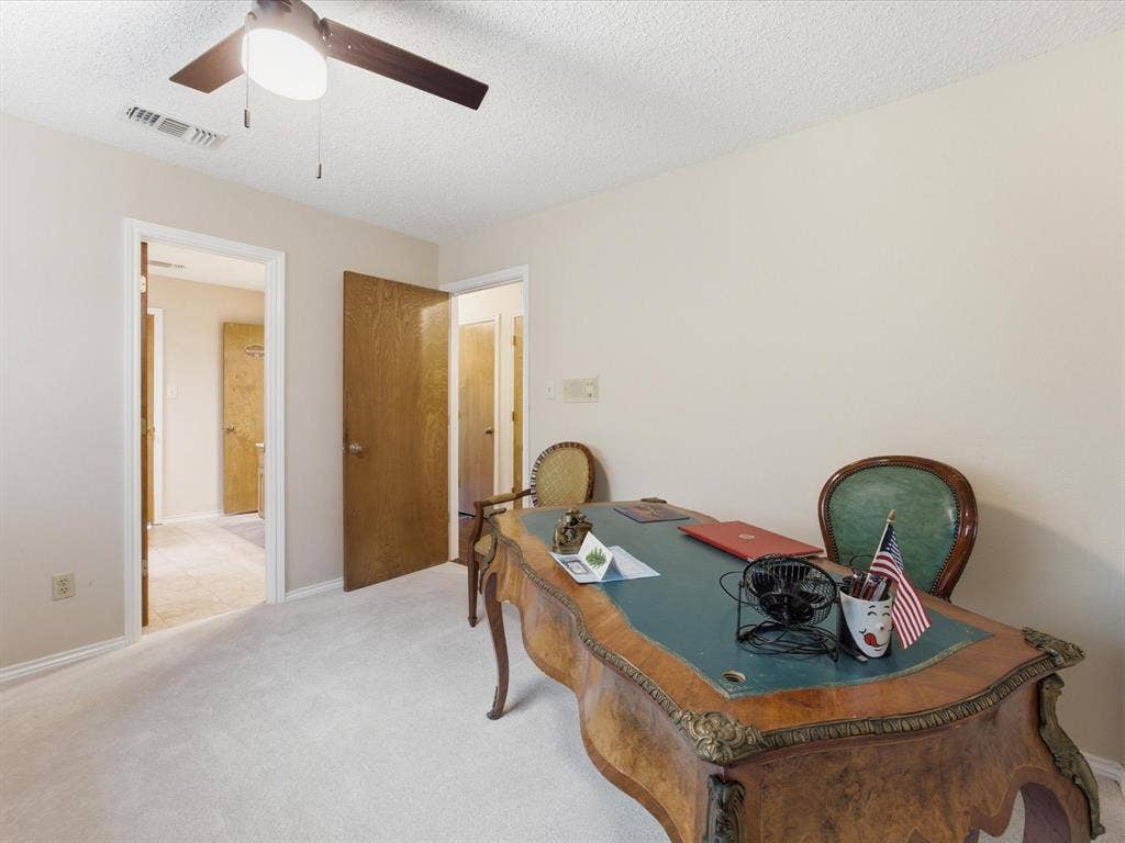 3701 Waycross Court, Arlington, TX 76016 Bedroom featuring neutral wall paint, light-colored carpet flooring, a ceiling fan with integrated lighting, and multiple doorways