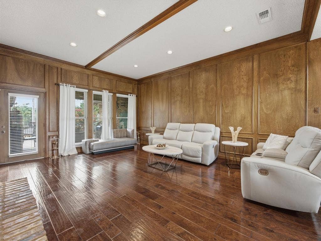 3701 Waycross Court, Arlington, TX 76016 Spacious room featuring wood-finish flooring, wood paneling with decorative trim, recessed lighting, and multiple windows with blinds