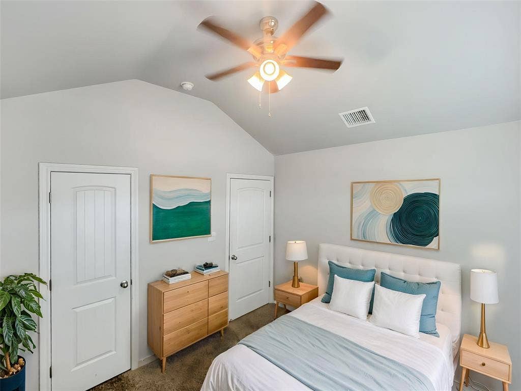 Virtually stagedVaulted ceiling with a ceiling fan