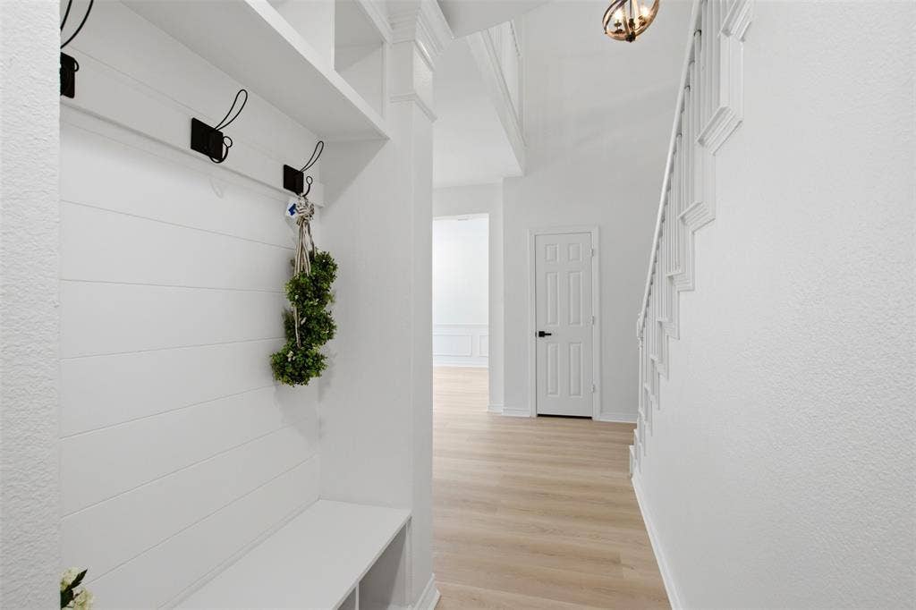 604 Creek View Drive, Prosper, TX 75078 mud room hallway behind the stairs
