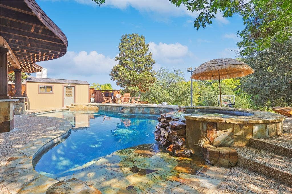 1088 Pondview Drive, Cedar Hill, TX 75104 Pool with fence and an outdoor structure