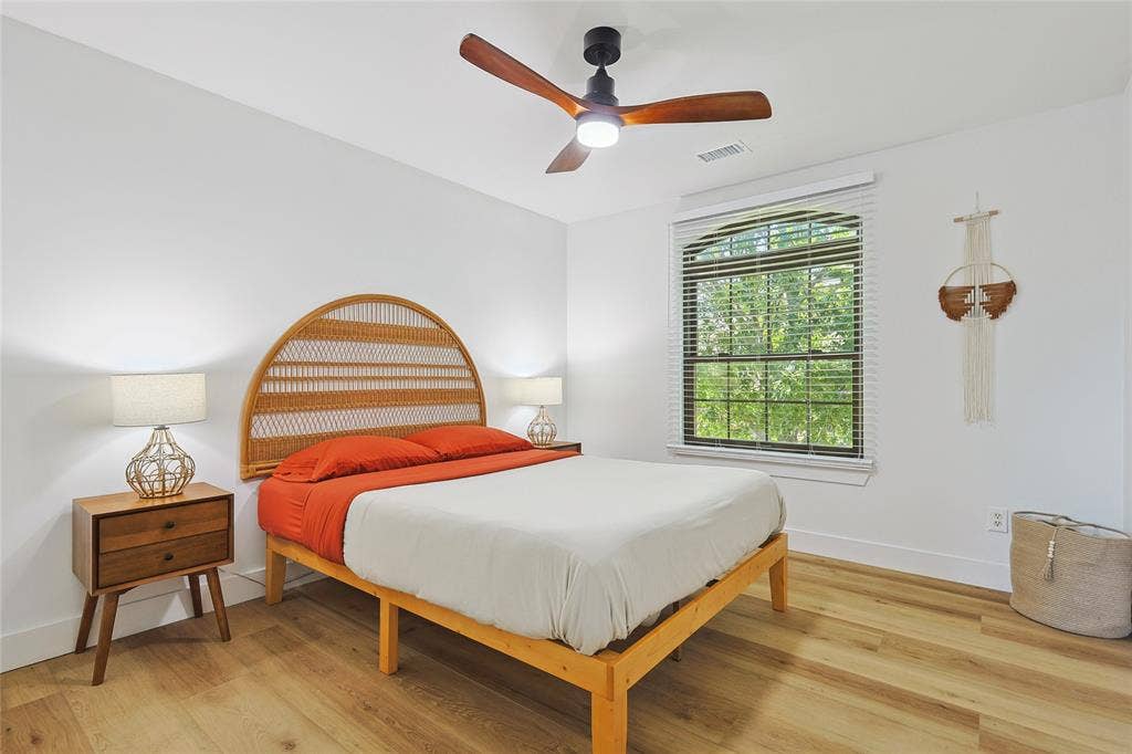 1088 Pondview Drive, Cedar Hill, TX 75104 Bedroom with ceiling fan, baseboards, light wood finished floors, and visible vents