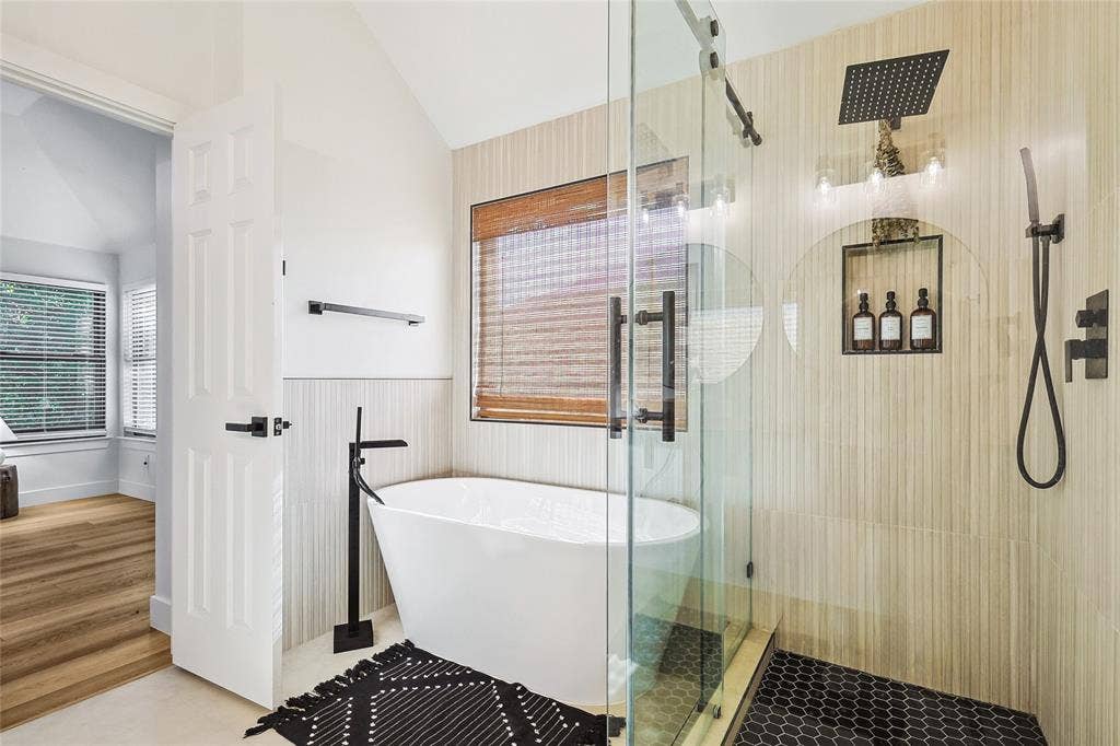 1088 Pondview Drive, Cedar Hill, TX 75104 Full bathroom featuring a wainscoted wall, a freestanding tub, vaulted ceiling, and a shower stall
