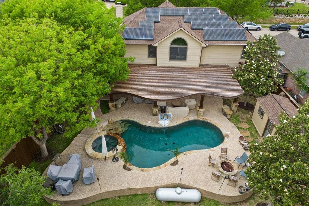 1088 Pondview Drive, Cedar Hill, TX 75104 View of swimming pool with a fenced backyard, an outdoor fire pit, a pool with connected hot tub, and a patio area